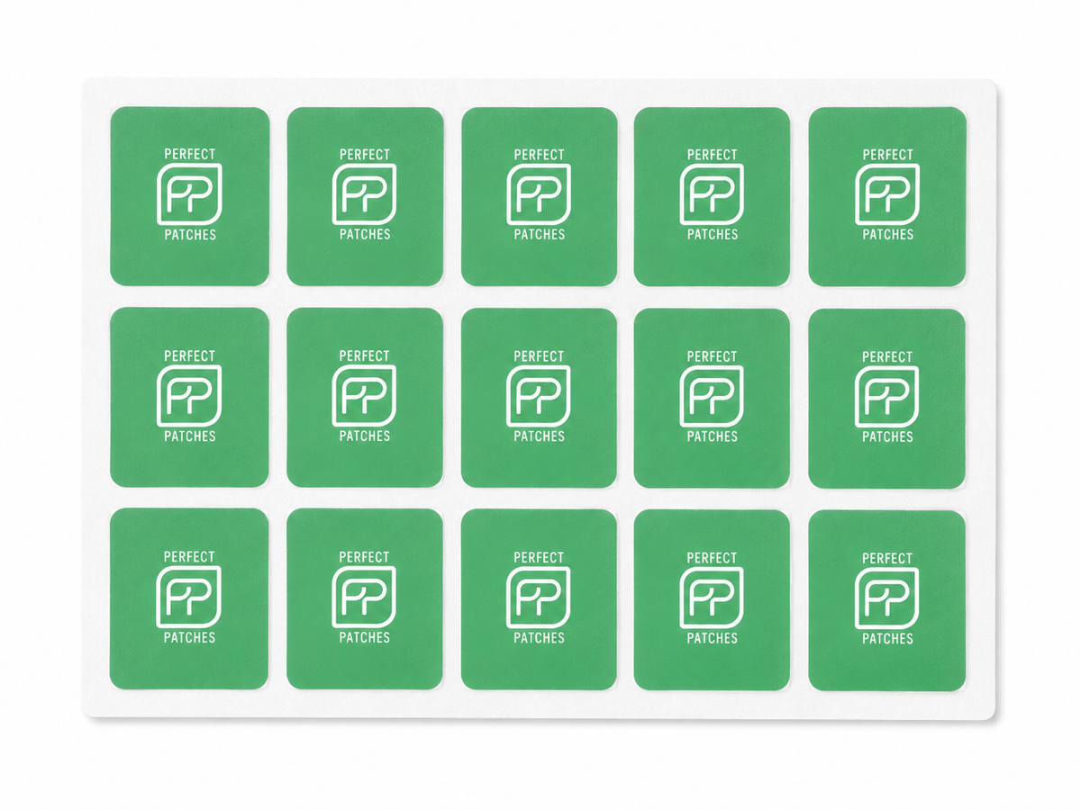 Sheet of green Perfect Patches Feel Good patches shown in a three by five grid
