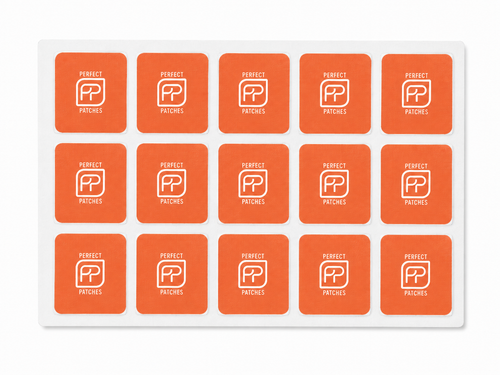 Sheet of orange Perfect Patches Mood patches shown in a three by five grid